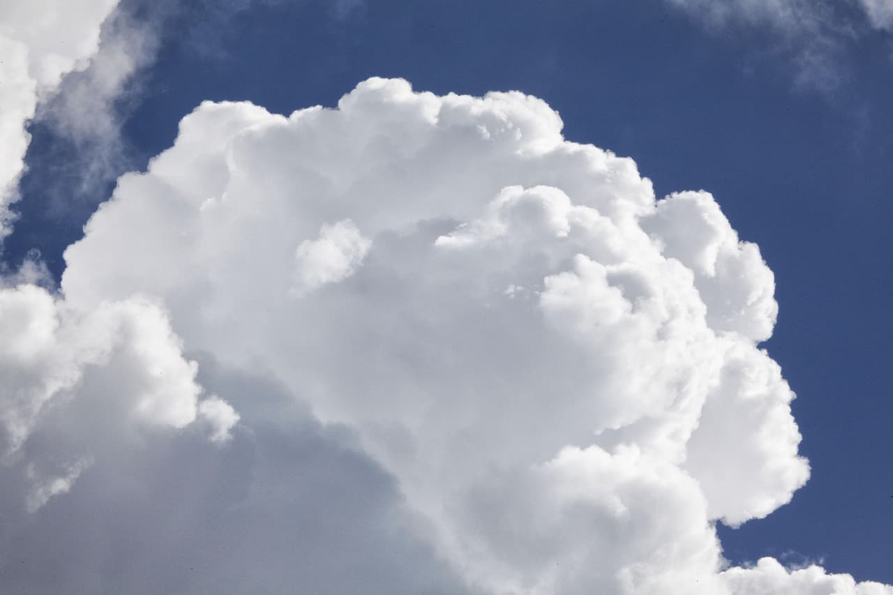 Towering storm clouds building above the horizon before severe weather.